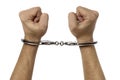 Handcuffed male hands isolated over white Royalty Free Stock Photo