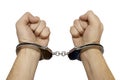 Handcuffed male hands isolated over white Royalty Free Stock Photo