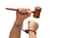 Handcuffed Man Holding Wooden Gavel on White Royalty Free Stock Photo