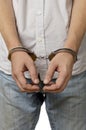 Handcuffed man isolated over white Royalty Free Stock Photo