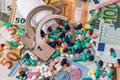 Handcuffs with bottle from pills on euro banknotes