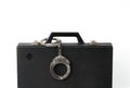 handcuffs chained to the handle of the Briefcase, close-up Royalty Free Stock Photo