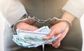 . Handcuffs, dollars and a business woman arrested for theft at work. Money, crime and punishment for fraud with female