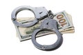 Handcuffs on dollars isolated. Concept on the topic of fraud with foreign exchange transactions
