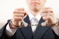 Handcuffs on hands Royalty Free Stock Photo