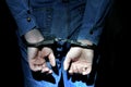 Handcuffs on Hands closeup Royalty Free Stock Photo