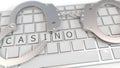 Handcuffs on keyboard with CASINO text on keys. Illegal online gambling related conceptual 3D rendering