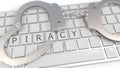 Handcuffs on keyboard with PIRACY text on keys. Computer crime related conceptual 3D rendering