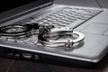 Handcuffs on laptop cyber crime concept Royalty Free Stock Photo