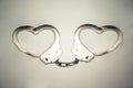 Handcuffs in a love heart Royalty Free Stock Photo