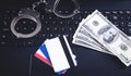 Handcuffs, money, credit cards on computer keyboard. Concept of Cyber crime and Online fraud Royalty Free Stock Photo