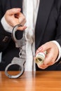 Handcuffs and money Royalty Free Stock Photo