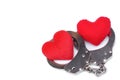 Handcuffs with a red love heart Royalty Free Stock Photo