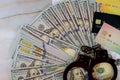 Handcuffs, US dollar banknotes cash credit cards on of cyber crime online fraud