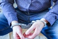 Handcuffs on the wrists of the detained man Royalty Free Stock Photo