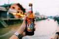 Handed bottle of cold Leo beer Royalty Free Stock Photo