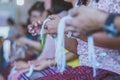 Handfasting. Selective focus on hands of Thai graduation ceremony.