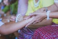 Handfasting. Selective focus on hands of Thai graduation ceremony.