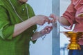 Handfasting. Selective focus on hands of Thai graduation ceremony.