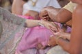 Handfasting. Selective focus on hands of Thai wedding ceremony.