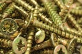 A handful of anodized screws background Royalty Free Stock Photo