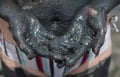 Handful of black healing mud Royalty Free Stock Photo