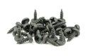 A handful of black screws d Royalty Free Stock Photo