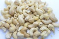 A handful of cashew nuts on a white background