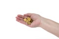 A handful of coins in the hands of an elderly woman