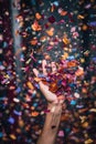 handful of confetti thrown in the air, creating a blurred effect