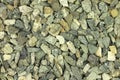 A handful of construction gravel gray background