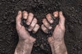 Handful of dirt hands holding soil hands touch the ground. Farmer hands full of soil field organic earth ground. Fertile