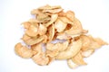 The handful of dried green apple lies on a table on a white background. Mound of dried fruits.