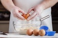 Handful of flour with egg on a rustic kitchen. Against the backg Royalty Free Stock Photo