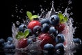 A handful of fresh ripe blueberries and cherries with green leaves in water splash. Isolated on black background. Royalty Free Stock Photo