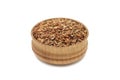 A handful of grains of rice in a wooden bowl