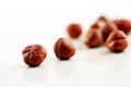 A handful of hazelnuts on a white background