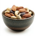 A handful of mixed nuts in a bowl, isolated on a white background, highlighting a variety of Royalty Free Stock Photo
