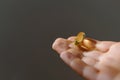 Handful with omega pills, healthy fats, vitamin E Royalty Free Stock Photo