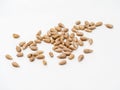 Handful peeled sunflower seeds isolated on white background. Close-up