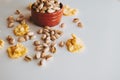 Handful of pistachios in a brown vase