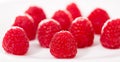 Handful of raspberry berries on white background