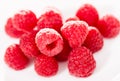 Handful of raspberry berries on white background