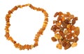 Handful of raw amber and necklace made of it Royalty Free Stock Photo