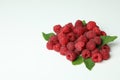 A handful of red juicy raspberries on a white background, close up Royalty Free Stock Photo
