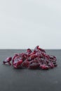 Handful of red sun-dried cranberries on black background Royalty Free Stock Photo