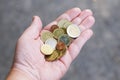 Handful of small loose pocket change euro cent coins in palm of hand Royalty Free Stock Photo