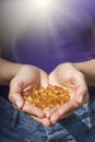 A handful of vitamin d capsules are in women`s hands