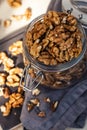 A handful of walnuts in a glass jar. Food photo for grocery stores, healthy snack, vegetarian food. Royalty Free Stock Photo