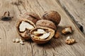 Handful walnuts on the wooden table closeup